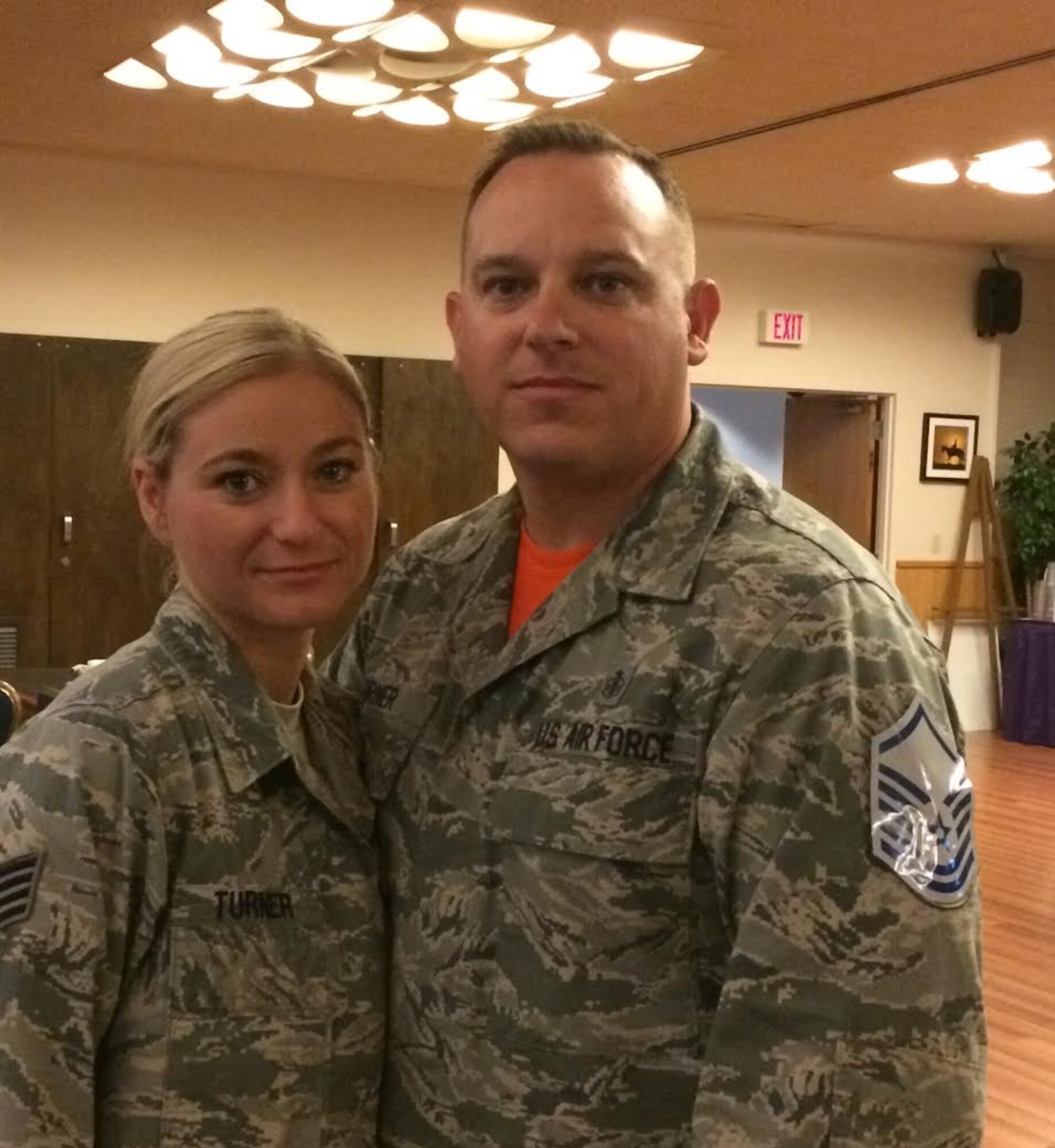 Tech. Sgt. Matthew Turner (right), NCO in charge of the 391st Fighter Squadron medical element, poses with his wife, Staff Sgt. Ann Turner, during the master sergeant promotion social July 17, 2015, at Mountain Home Air Force Base, Idaho. Matthew was selected for promotion to master sergeant two weeks prior to his wife's promotion to technical sergeant. (Courtesy Photo)
