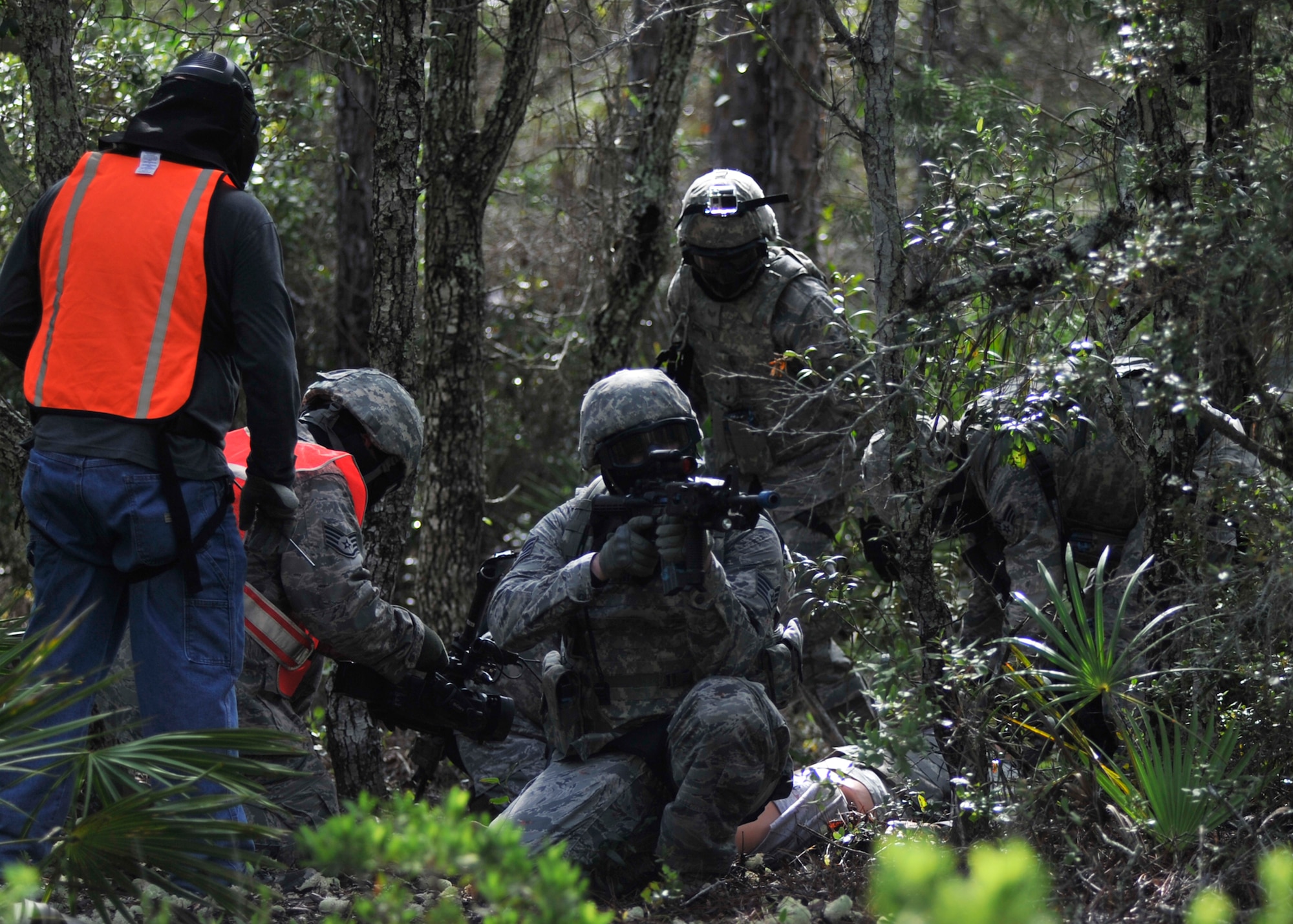 The 325th Security Forces Squadron participated in a self-aid buddy care under fire exercise Aug. 18 at the security forces training grounds. The purpose of the exercise was to maintain certifications and give Airmen experience in SABC in a simulated combat area. (U.S. Air Force photo by Airman 1st Class Sergio A. Gamboa/Released)