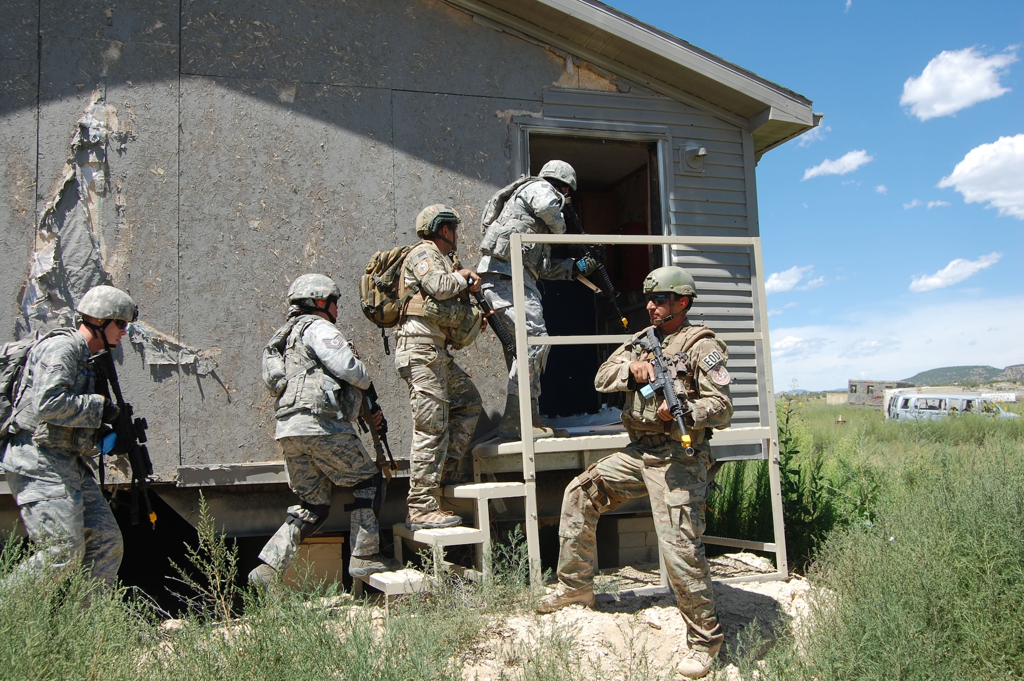 Members of the140th Explosive Ordnance Disposal Flight and the140th Security Forces Squadron, 140th Wing, Colorado Air National Guard, executed a multi-stage mission scenario, while simultaneously being evaluated by the Inspector General team to identify weaknesses and improve tactics August 6 at Airburst Range, Fort Carson, Colo. (US Air National Guard photo by Capt. Kinder Blacke)