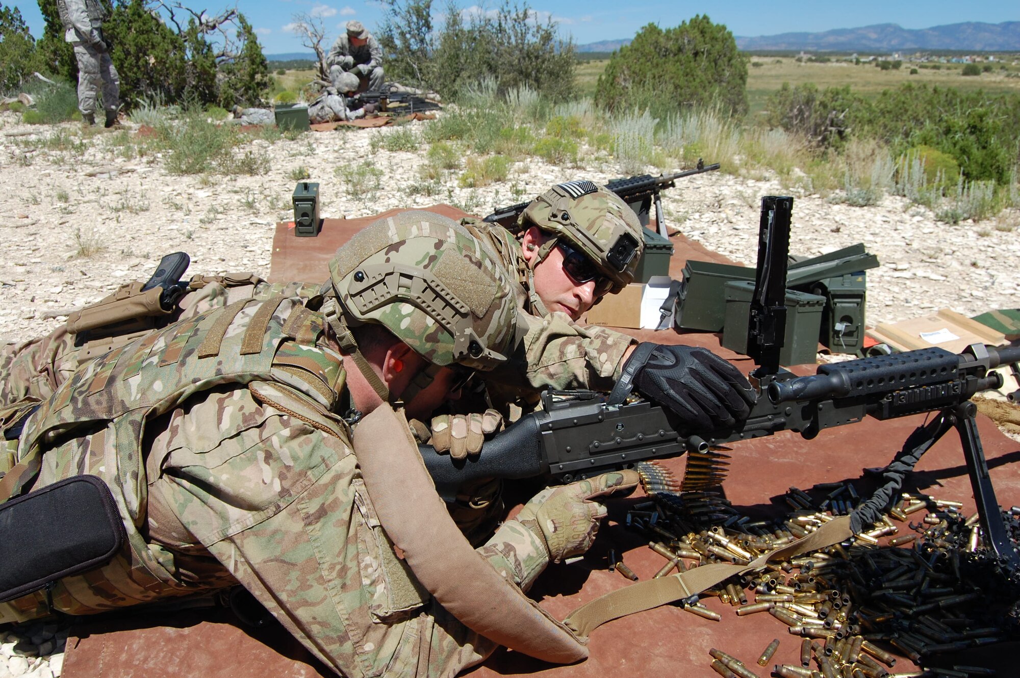 Members of the140th Explosive Ordnance Disposal Flight and the140th Security Forces Squadron, 140th Wing, Colorado Air National Guard, accomplish annual shooting qualifications during a joint training day August 4 at Airburst Range, Fort Carson, Colo. (US Air National Guard photo by Capt. Kinder Blacke)