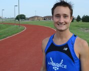 Capt. Daniel Castle, 349th Air Refueling Squadron pilot, poses for a photo at the half-mile track, Aug. 14, 2015, at McConnell Air Force Base, Kan. Castle is passionate about running for the love of competition, reducing stress and pushing himself to do the best in everything he does. (U.S. Air Force photo by Airman 1st Class Christopher Thornbury)
