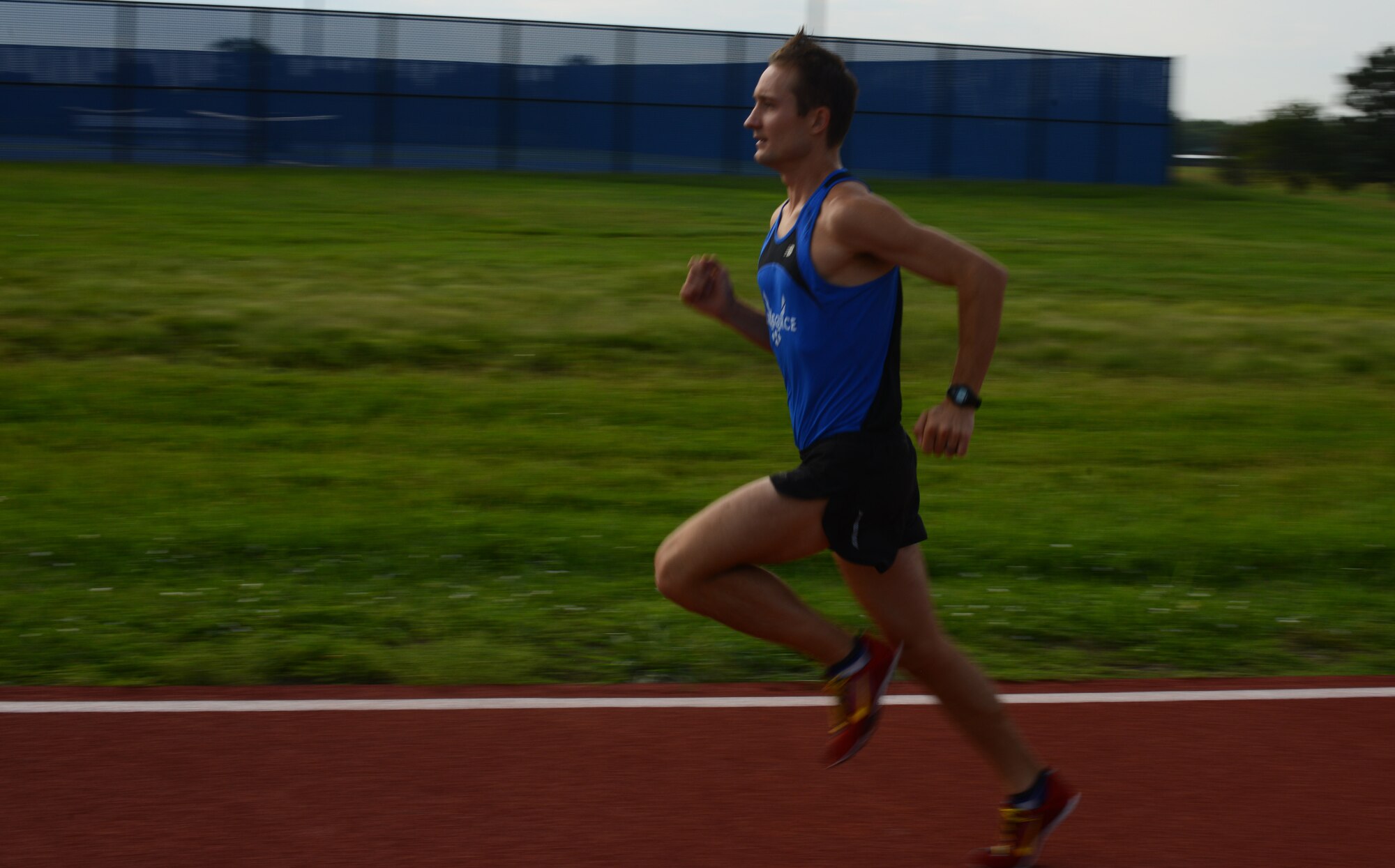 Capt. Daniel Castle, 349th Air Refueling Squadron pilot, runs on the half-mile track, Aug. 14, 2015, at McConnell Air Force Base, Kan. Castle runs each day to contribute to his goal of being an Olympic 1500 meter runner. (U.S. Air Force photo by Airman 1st Class Christopher Thornbury)