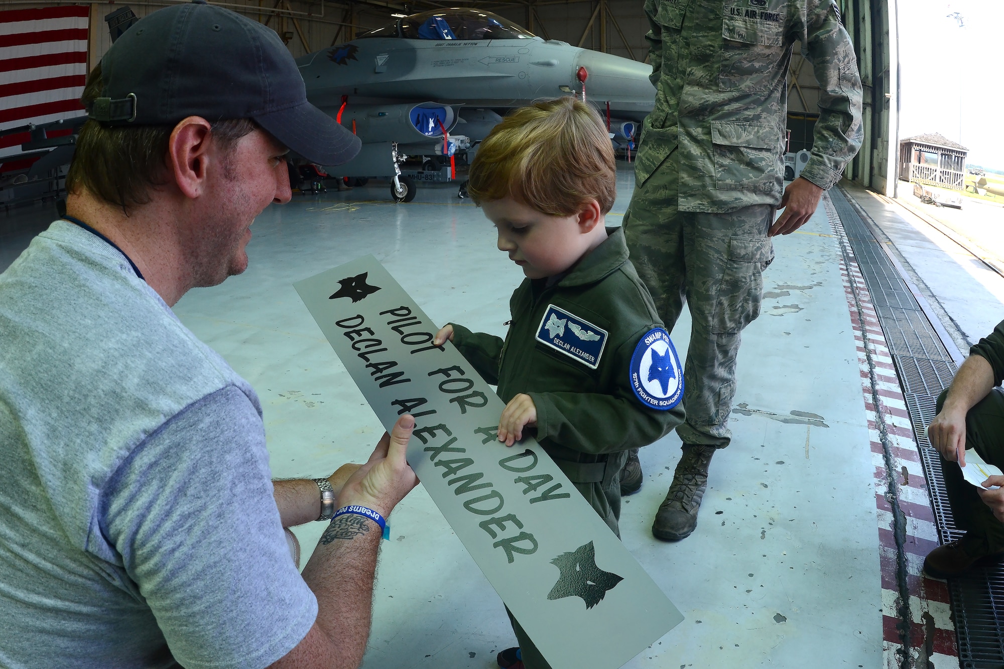 Declan Alexander visits McEntire Joint National Guard Base, Eastover, S.C., as the Swamp Fox “Pilot for a Day”, Aug. 15, 2015. Declan spent the day with U.S. Air Force 1st Lt. Cody "Rail" May, a fighter pilot with the 157th Fighter Squadron, and watched F-16 fighter jets land, toured aircrew flight equipment, sat in the cockpit of an F-16, and took a ride in a fire truck. The Pilot for a Day program is an opportunity for disadvantaged or seriously ill children to spend a day with members of the South Carolina Air National Guard. (S.C. Air National Guard photo by Airman 1st Class Ashleigh Pavelek/Released)