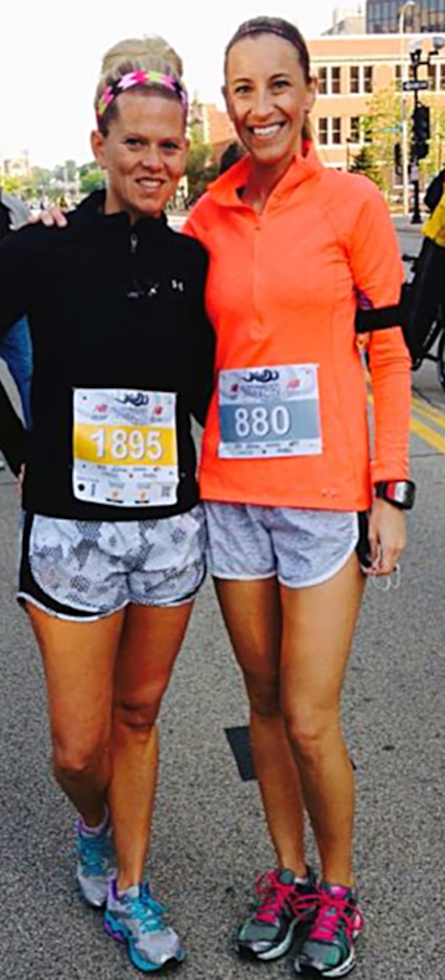 U.S. Air Force 1st Lt. Allison R. Schore, right, a medical administrative officer with the 182nd Medical Group, takes a photo with a friend before running a half-marathon in this undated photo in Peoria, Ill. Schore relied on good foundations in mental, physical, social and spiritual wellness in the aftermath of witnessing a shooting at a restaurant while with her family. (Photo courtesy of Allison Schore/Released)