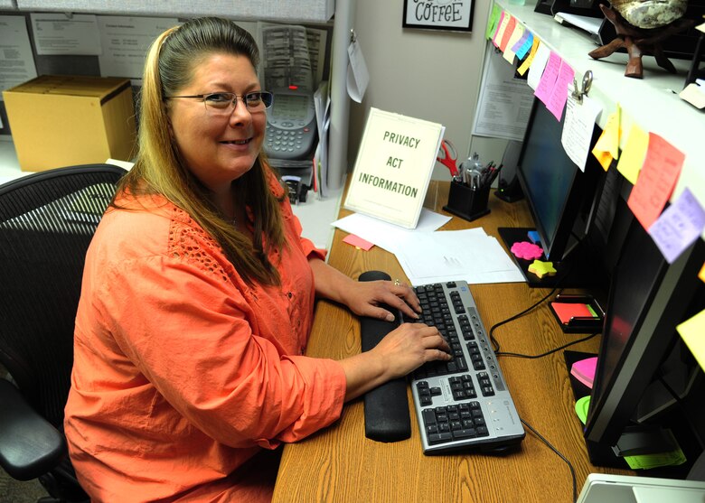 Patricia Soper, 319th Medical Support Squadron referral coordinator, works at her desk August 18, 2015, on Grand Forks Air Force Base, North Dakota. Soper was named the Warrior of the Week for the third week of August. (U.S. Air Force photo by Airman 1st Class Ryan Sparks/Released)
