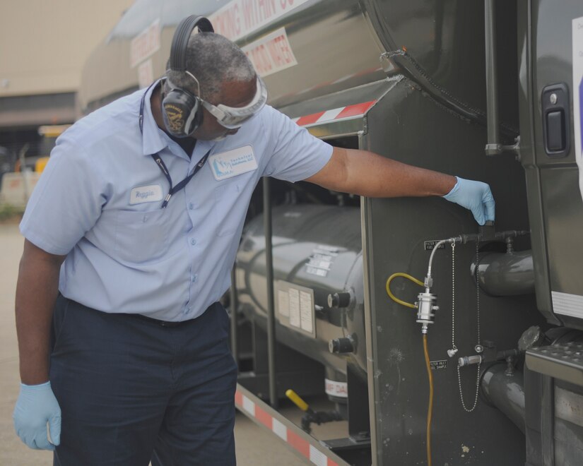 Reggie Moore, 11th Logistics Readiness Squadron fuels technician, collects fuel for testing Aug. 19, 2015, on Joint Base Andrews, Md. Depending on the type and storage location, fuel must be regularly tested as often as every two weeks or as little as once a month. (U.S. Air Force photo by Senior Airman Preston Webb/RELEASED)