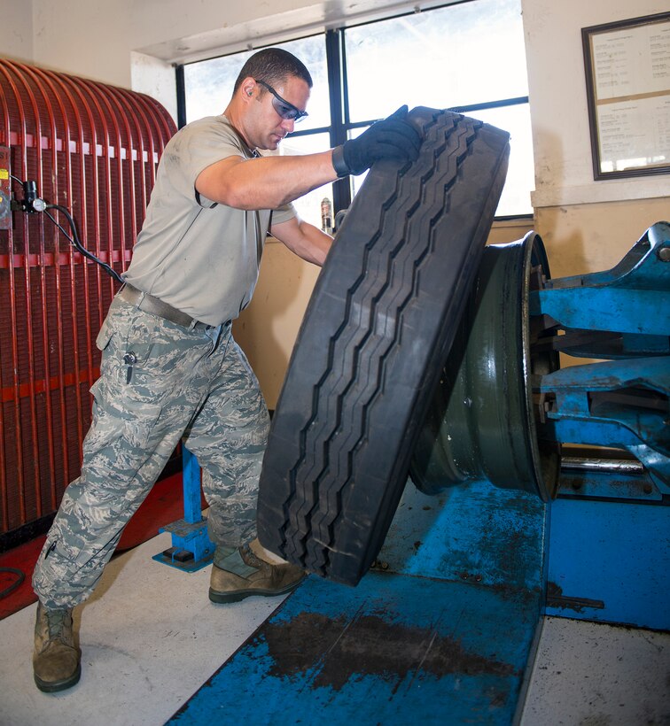 U.S. Air Force Staff Sgt. Ryan Beckham, 23d Logistics Readiness Squadron vehicle maintenance technician, mounts a MP-2 tire Aug. 10, 2015, at Moody Air Force Base, Ga. The Vehicle Management Flight maintains and services all of Moody’s general purpose transportation as well as fire protection vehicles, cargo loaders, forklifts, aircraft refueling vehicles, flightline support and civil engineering heavy equipment. (U.S. Air Force photo by Airman 1st Class Greg Nash/Released)