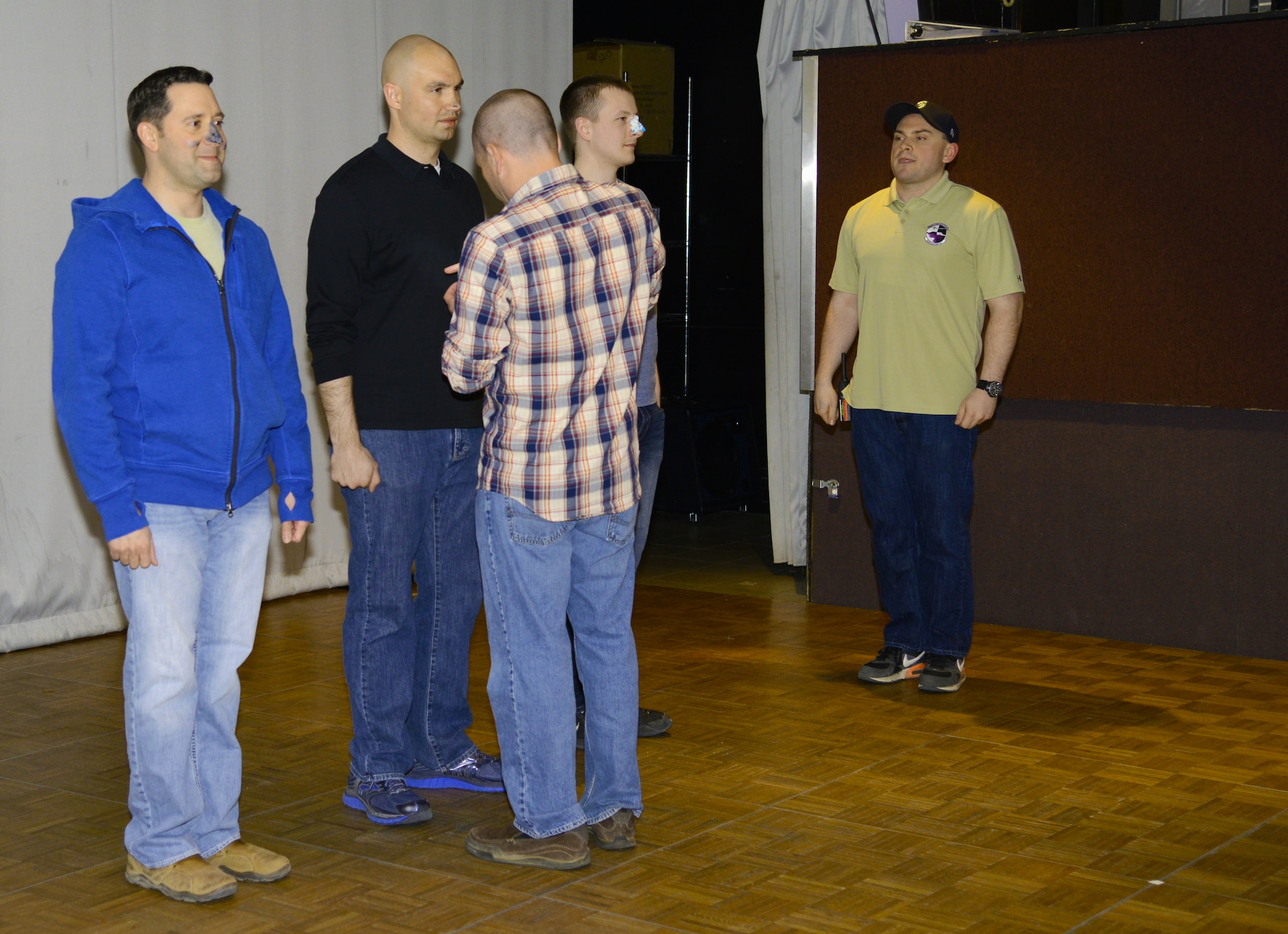 THULE AIR BASE, Greenland – Departing members of the 821st Air Base Group receive their Blue nose during an induction in July 2015. Being inducted into the Arctic Order, Knights of the Blue Nose, is the method of recognition for all those who survive a short tour at the Top of the World. (U.S. Air Force photo by Tech. Sgt. Jared Marquis)
