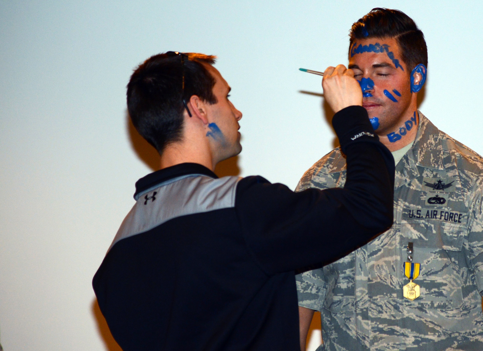 THULE AIR BASE, Greenland – Master Sgt. Christopher Boyd’s face is painted as part of a 12th Space Warning Squadron Blue Nose ceremony in July 2015. The 12th SWS ceremony is unique in that it is a small affair and instead of a Blue Nose, all unit members paint a blue mark signifying their individual goodbye message. (U.S. Air Force photo by Tech. Sgt. Jared Marquis)