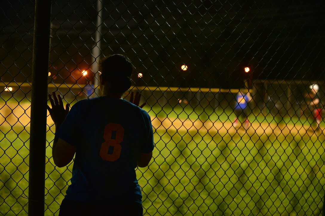 U.S. Army Capt. Amanda Self, U.S. Army Training and Doctrine Command team second baseman, watches a teammate prepare to swing during the Fort Eustis Intramural Softball championship game at Fort Eustis, Va., Aug. 14, 2015. Self said she began playing the sport at the age of 5, and has continued throughout her Army career. (U.S. Air Force photo by Staff Sgt. Natasha Stannard/Released)