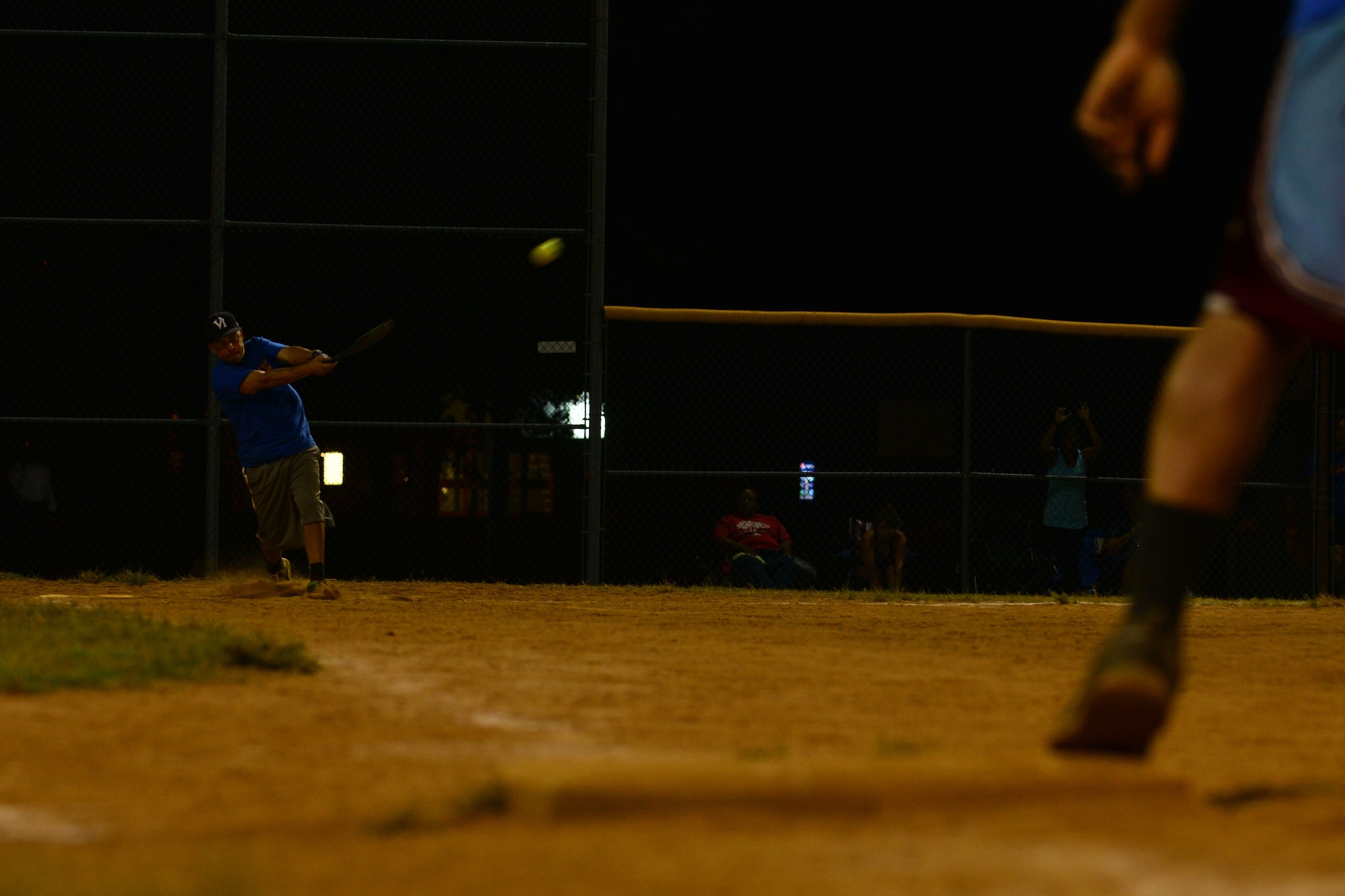 Michael Slaughter, U.S. Army Training and Doctrine Command team first baseman, hits the ball during the Fort Eustis Intramural Softball tournament at Fort Eustis, Va., Aug. 14, 2015. Slaughter’s team played six games in two nights to play in the championship game, which they won. (U.S. Air Force photo by Staff Sgt. Natasha Stannard/Released)