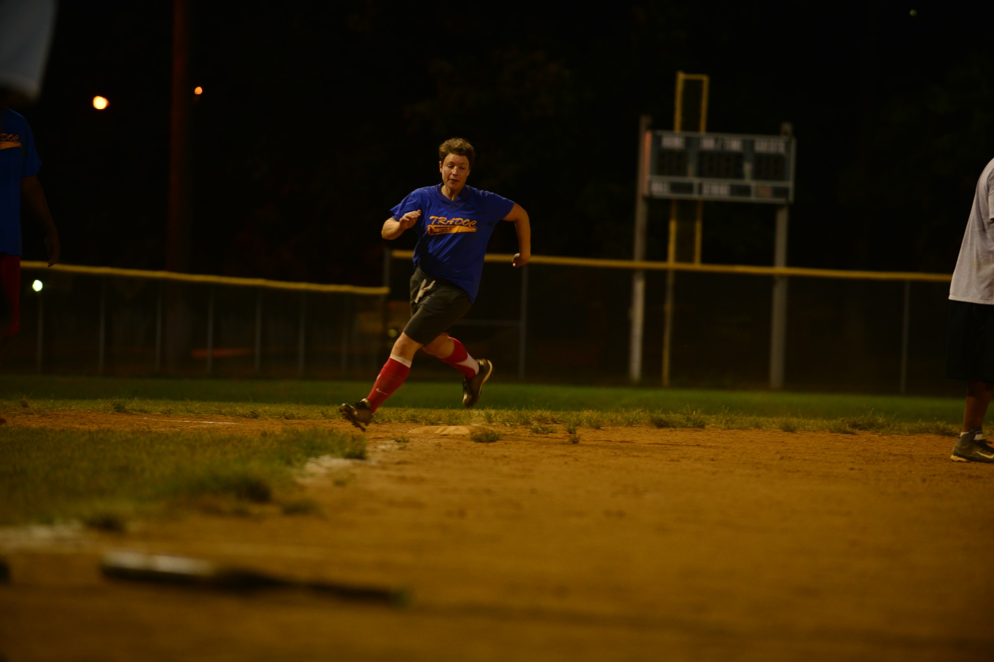 U.S. Army Capt. Amanda Self, U.S. Army Training and Doctrine Command team second baseman, runs to home plate during the Fort Eustis Intramural Softball championship game at Fort Eustis, Va., Aug. 14, 2015. The TRADOC team won the double elimination championship game against the 359th Inland Cargo Transfer Company Chaos team. (U.S. Air Force photo by Staff Sgt. Natasha Stannard/Released)