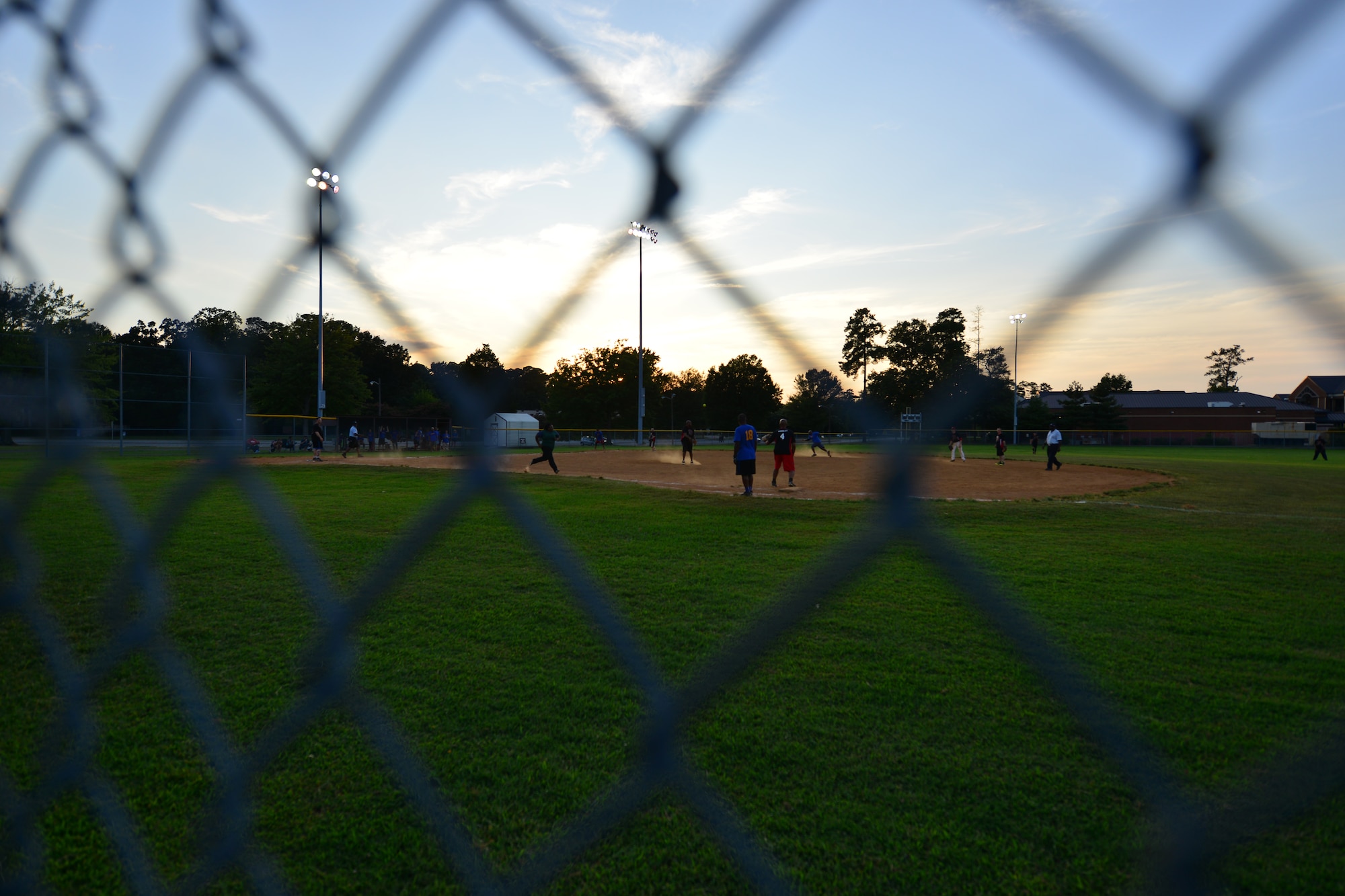 U.S. Army Training and Doctrine Command and the 149th Transportation Company Spartans play in the Intramural Softball tournament at Fort Eustis, Va., Aug. 14, 2015. After winning against the Spartans, the TRADOC team moved on to the double-elimination championship game against the 359th Inland Cargo Transfer Company Chaos team. . (U.S. Air Force photo by Staff Sgt. Natasha Stannard/Released)