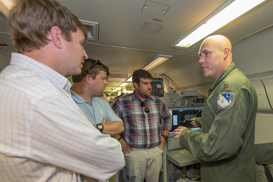 U.S. Air Force Maj. Jason Misencik, chief of scheduling with the 461st Air Control Wing (ACW), briefs staff delegates from several Georgia congressional and senate offices on the operation of the E-8C Joint STARS aircraft during their visit to Robins Air Force Base, Ga., Aug. 18, 2015. During the visit, the delegates received a mission briefing updating them on the JSTARS program and an orientation tour of the aircraft. Team JSTARS; consisting of the 116th ACW, Georgia Air National Guard, the 461st ACW and Army JSTARS, is the sole location for the E-8C Joint STARS flying operation providing one-of-a-kind manned, battle management, command and control, intelligence, surveillance and reconnaissance support to combatant commanders around the globe. (U.S. Air National Guard photo by Senior Master Sgt. Roger Parsons/Released)