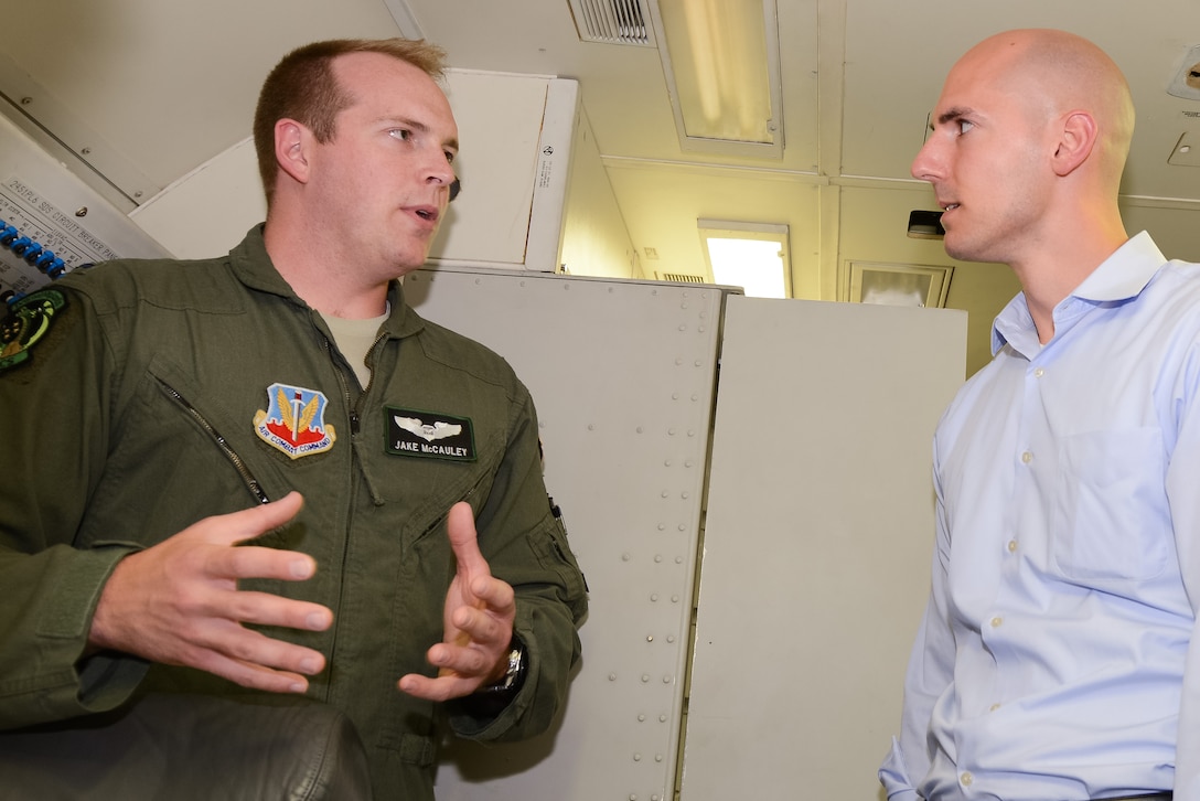 U.S. Air Force 1st Lt. Jake McCauley, a navigator with the 461st Air Control Wing (ACW), briefs Matt Hodge, a congressional delegate for Rep. Austin Scott, GA-08, during a tour where staff delegates from several Georgia congressional and senate offices toured Team JSTARS and the E-8C Joint STARS aircraft during a visit to Robins Air Force Base, Ga., Aug. 18, 2015. During the visit, the delegates received a mission briefing updating them on the JSTARS program and an orientation tour of the aircraft. Team JSTARS; consisting of the 116th ACW, Georgia Air National Guard, the 461st ACW and Army JSTARS, is the sole location for the E-8C Joint STARS flying operation providing one-of-a-kind manned, battle management, command and control, intelligence, surveillance and reconnaissance support to combatant commanders around the globe. (U.S. Air National Guard photo by Tech. Sgt. Regina Young/Released)