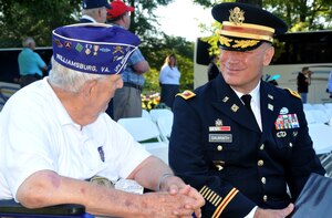U.S. Army Col. William Galbraith, 733rd Mission Support Group commander, talks
with an Army veteran at Williamsburg Memorial Park, Va., Aug 16, 2015.  Galbraith joined
visiting veterans to observe "Spirit of '45 Day," a national effort to honor the legacy of the men and women of the WWII generation. August 14th marked the 70th anniversary of the end of WWII. Of the 16 million who served in the war, an estimated 405,000 died and 672,000 were wounded. Over 73,000 U.S. Service members remain unaccounted for. (U.S. Army photo by Greg Mueller/Released)
