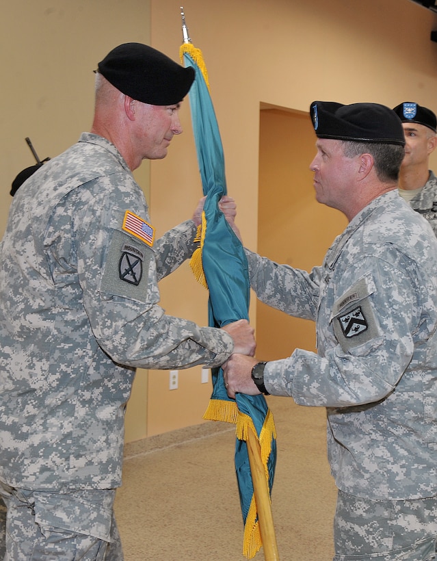U.S. Army Brig. Gen. Mark J. O’Neil, Combined Arms Center-Training deputy commander, right, passes the colors to Col. John R. Allen, U.S. Army Training Support Center commander, during the ATSC change of command ceremony at Fort Eustis, Va., Aug. 17, 2015. Allen formerly served as a U.S. Marine enlisted infantryman and also served as the deputy commander of the 4th Brigade Combat Team, 3rd Infantry Division (Heavy) during his previous assignment. (U.S. Army photo by Rodney E. Speed/Released)