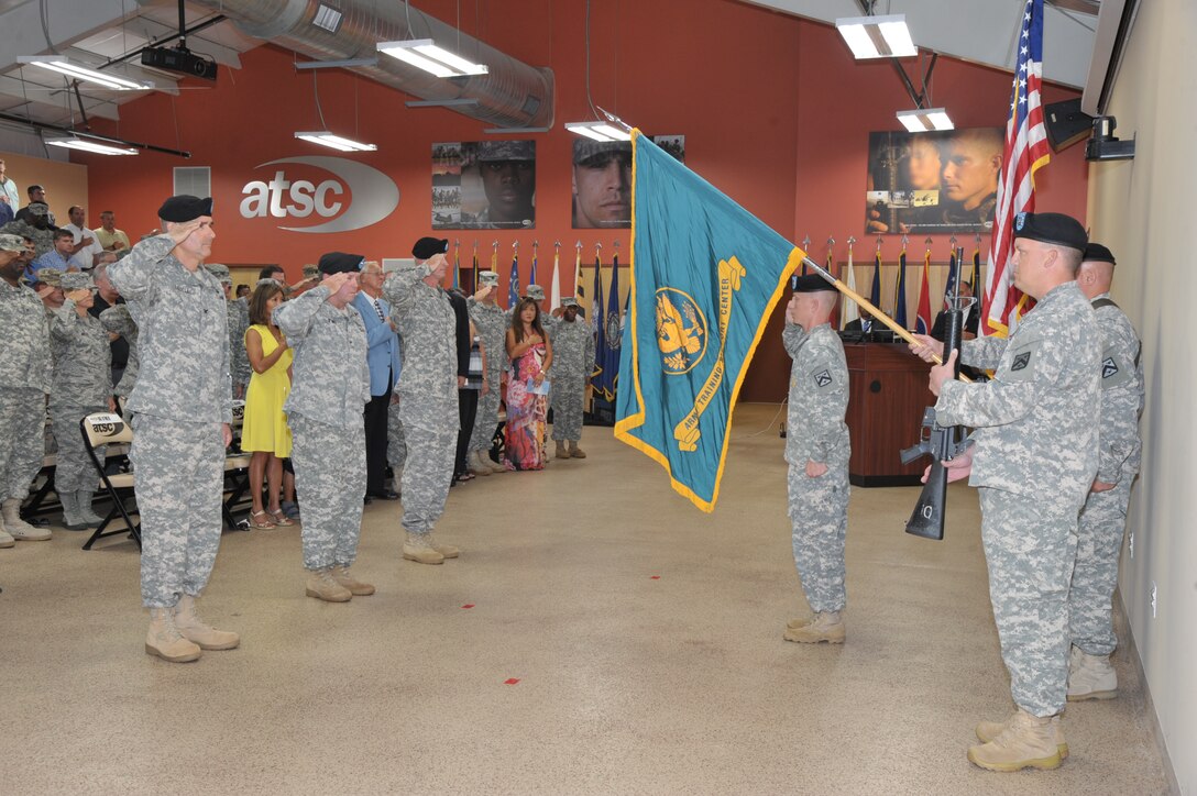 U.S. Army Training Support Center members salute the colors during the ATSC change of command ceremony at Fort Eustis, Va., Aug. 17, 2015. The ATSC commander oversees ATSC’s missions to plan, integrate, implement, and sustain training support functions across the Army. (U.S. Army photo by Rodney E. Speed/Released)
