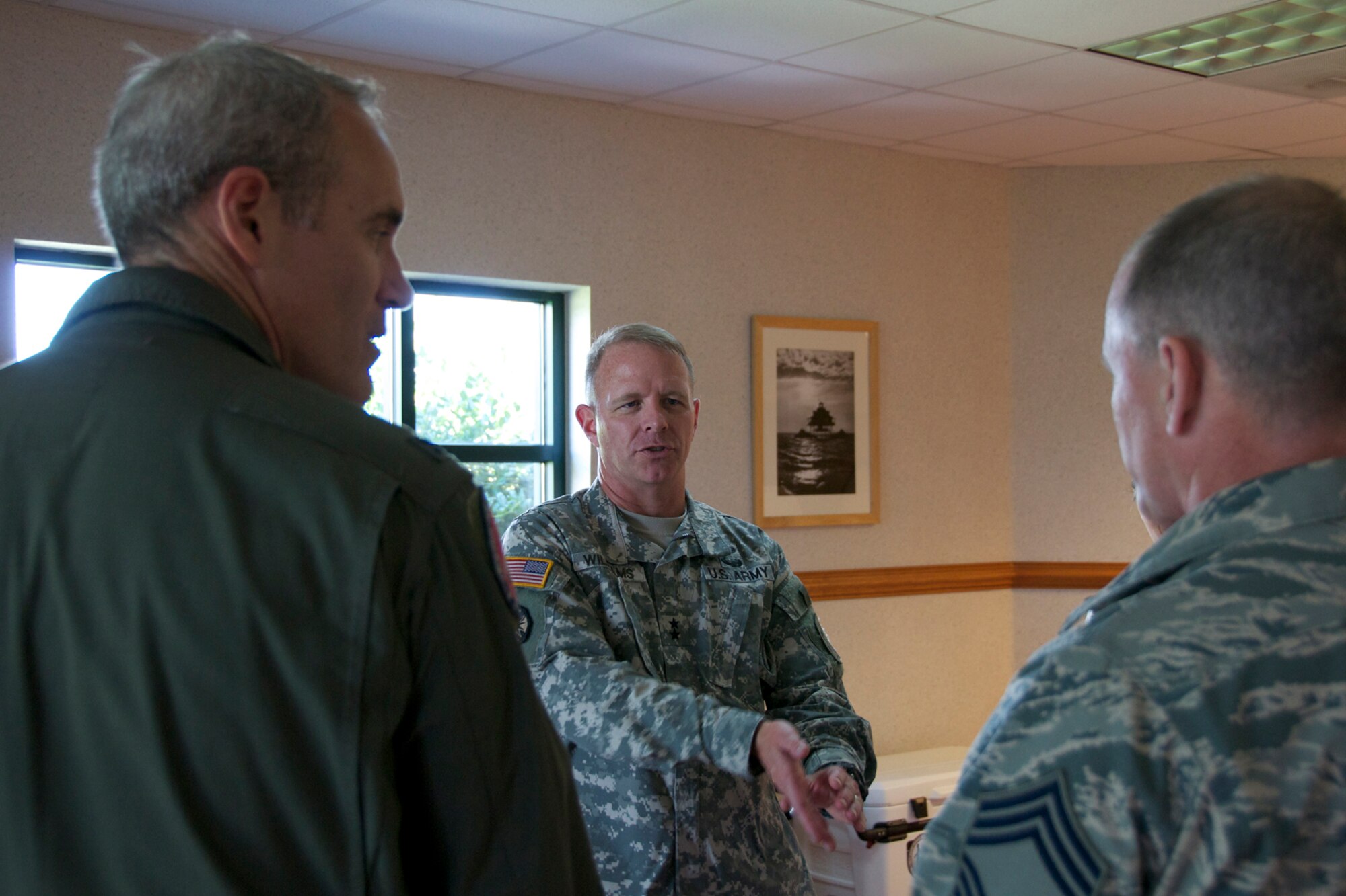 Maj. Gen. Timothy P. Williams, the Adjutant General of Virginia, joined by Col. Robert J. Grey 192d Fighter Wing commander and Chief Master Sgt. David, 192d Intel squadron discuss the Domestic Incident Awareness and Assessment Exercise at Camp Pendleton in the Virginia Beach area. Members’ of the 192d Intelligence Squadron, the Virginia Joint Forces Headquarters, Civil Air Patrol and local emergency response agencies participated in an Incident Awareness and Assessment (IAA) exercise at Camp Pendleton, Virginia Beach, Virginia, July 22, 2015. (U.S. Air National Guard photo by Master Sgt. Carlos J. Claudio/Released)