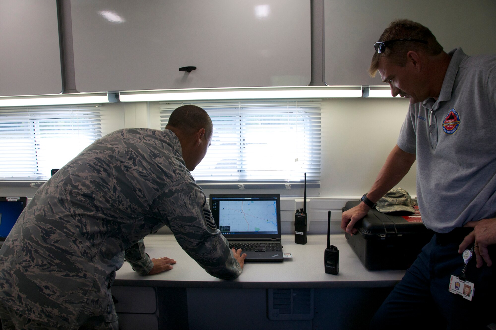 A 192d Intelligence Squadron member performs an Incident Awareness Assessment in the Virginia Beach area. Members’ of the 192d Intelligence Squadron, the Virginia Joint Forces Headquarters, Civil Air Patrol and local emergency response agencies participated in an Incident Awareness and Assessment (IAA) exercise at Camp Pendleton, Virginia Beach, Virginia, July 22, 2015. (U.S. Air National Guard photo by Master Sgt. Carlos J. Claudio/Released)