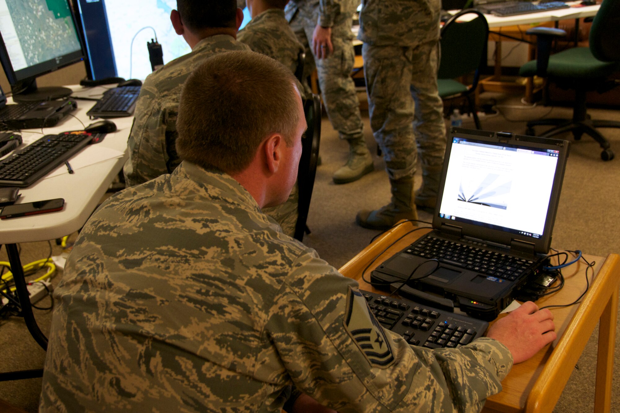 A 192d Intelligence Squadron member performs an Incident Awareness Assessment in the Virginia Beach area. Members’ of the 192d Intelligence Squadron, the Virginia Joint Forces Headquarters, Civil Air Patrol and local emergency response agencies participated in an Incident Awareness and Assessment (IAA) exercise at Camp Pendleton, Virginia Beach, Virginia, July 22, 2015. (U.S. Air National Guard photo by Master Sgt. Carlos J. Claudio/Released)