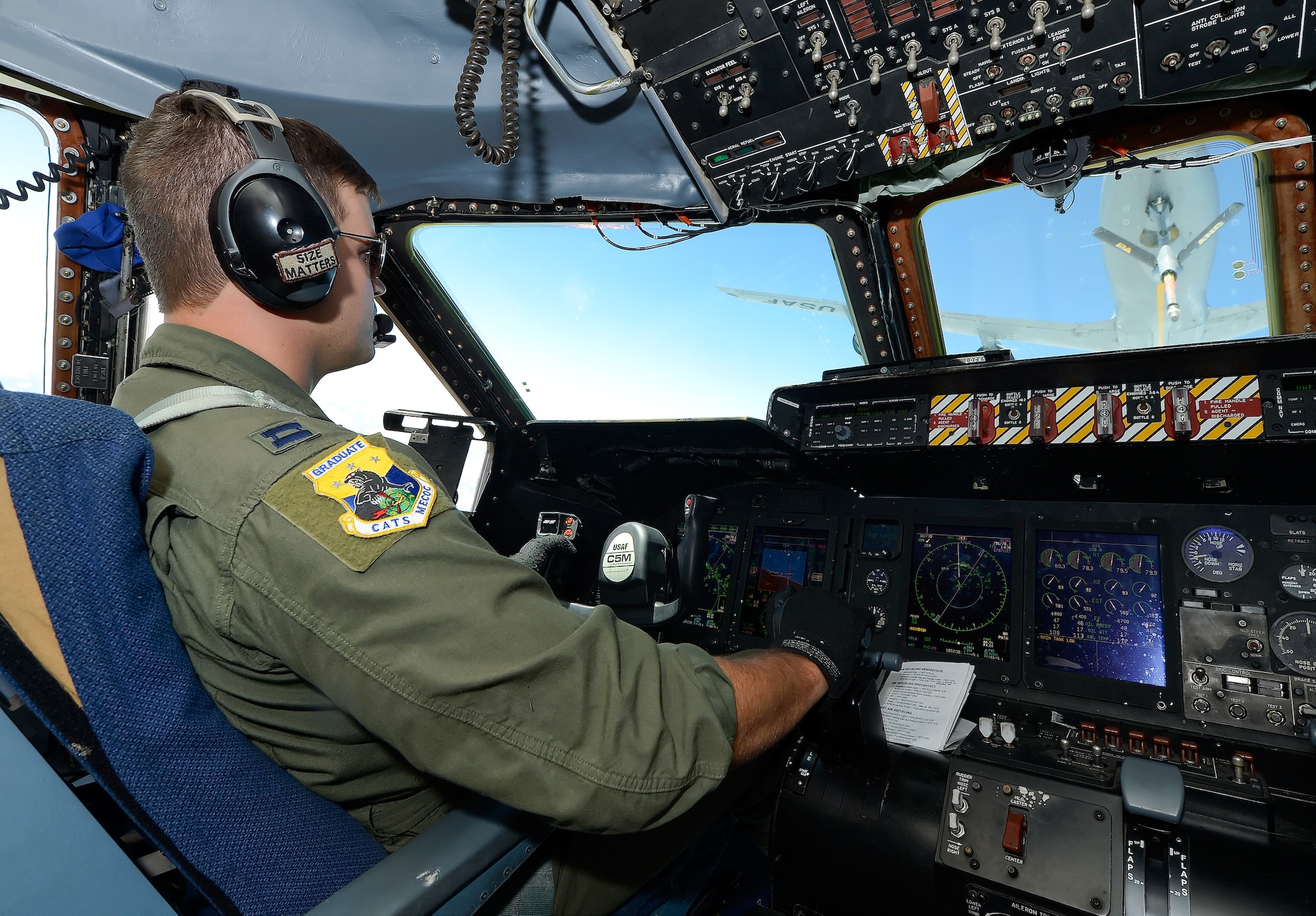 Capt. Justin Lapin, 9th Airlift Squadron C-5M Super Galaxy pilot, positions the aircraft below and behind a KC-135R Stratotanker Aug. 11, 2015, during a training mission from Dover Air Force Base, Del. The C-5M is assigned to the 436th Airlift Wing while the KC-135R is assigned to the 171st Air Refueling Wing, Pittsburgh International Airport, Pennsylvania Air National Guard. (U.S. Air Force photo/Greg L. Davis)
