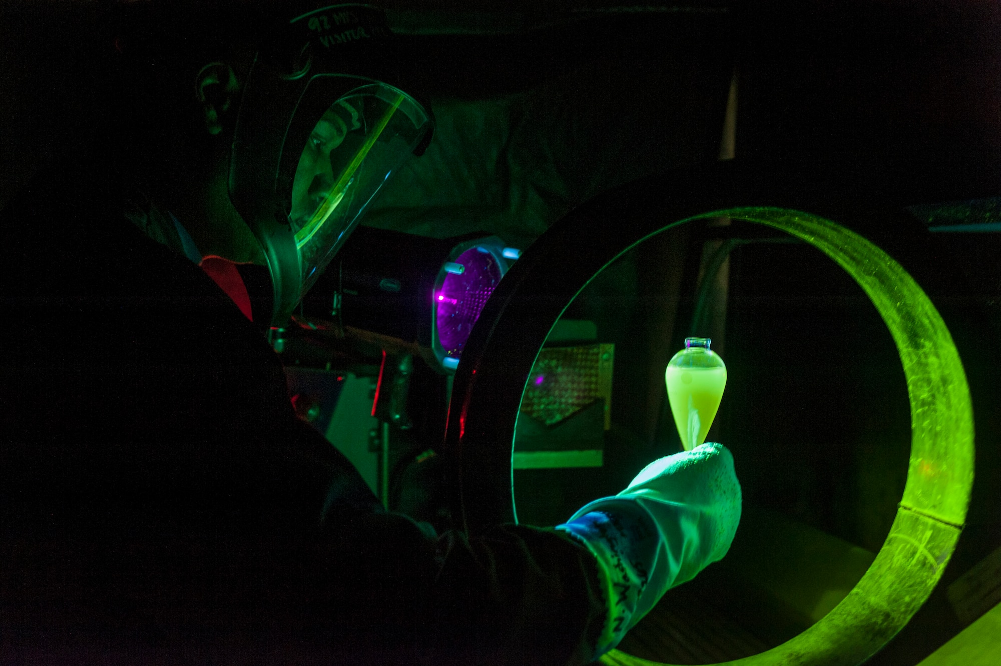 Staff Sgt. Christopher Hooper, 92nd Maintenance Squadron nondestructive inspection journeyman, uses a magnetic oil bath to ensure the magnetic particle machine is ready to conduct an inspection July 9, 2015, at Fairchild Air Force Base, Wash. With a magnetic particle machine, NDI is able to find cracks on both the inside and outside of a part. (U.S. Air Force photo/Airman Sean Campbell)
