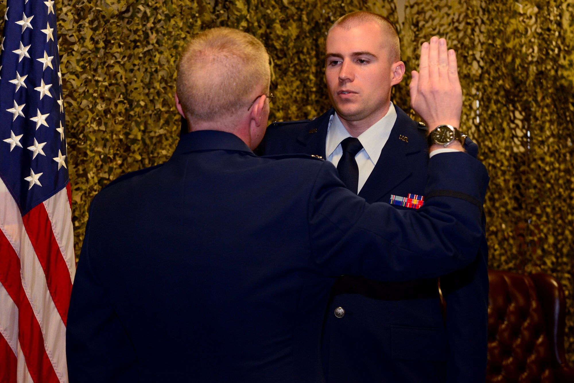 Staff Sgt. Brandon Longstreet, 2nd Medical Group public health technician, takes the Air Force oath of office prior to his direct commission to Medical Service Corps as a first lieutenant during a commissioning ceremony at Barksdale Air Force Base, La., Aug. 14, 2015. MSC provides leadership, operational and administrative support, and administers the provision of medical assistance to Airmen and their families. (U.S. Air Force Photo/Airman 1st Class Luke Hill)