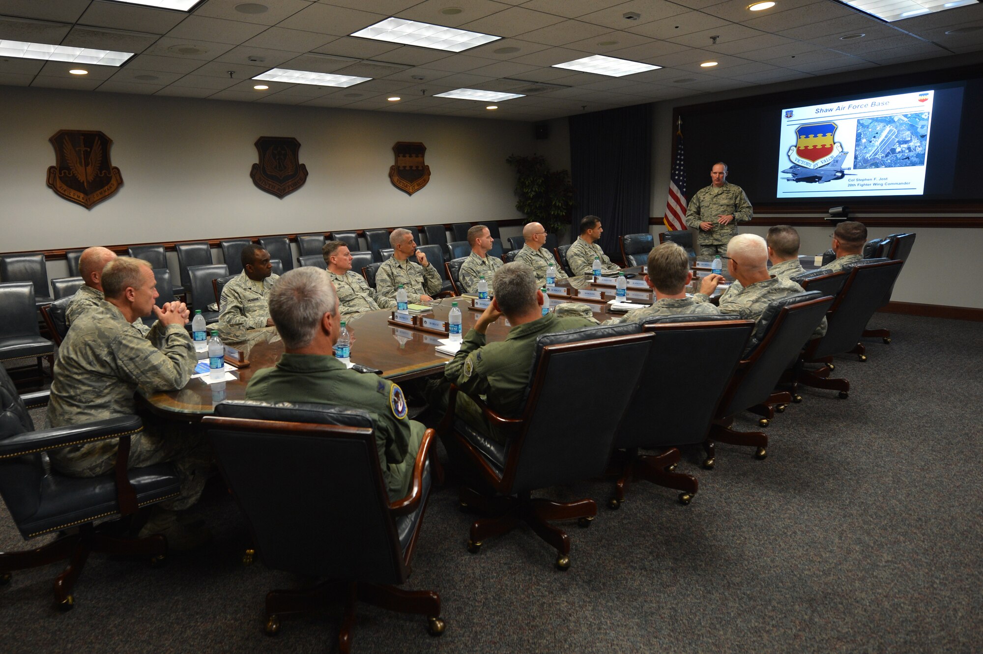 U.S. Air Force Maj. Gen. Mark Kelly, Ninth Air Force commander, is briefed by Col. Stephen Jost, 20th Fighter Wing commander, during an immersion tour at Shaw Air Force Base, S.C., Aug. 6, 2015. Kelly, the new Ninth Air Force commander who assumed command July 31, received briefings on the operations of the 20th FW, including the first sergeants, 20th Medical Group, 20th Mission Support Group, 20th Maintenance Group, and the 20th Operations Group. (U.S. Air Force photo by Senior Airman Diana M. Cossaboom/Released)
