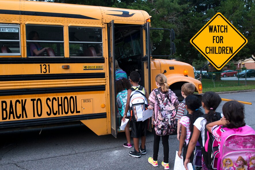 School is in session, meaning buses are on the road for the school year. Drivers should exercise caution when traveling in proximity to school zones and  school buses. Georgia law requires vehicles traveling in both directions to stop when a school bus is loading or unloading children. School buses display red stop lights and a stop arm to let traffic know to stop and watch for children. The driver may proceed only when the school bus resumes movement or when the flashing lights are no longer activated. (U.S. Air Force photo illustration by Airman 1st Class Kathleen D. Bryant)