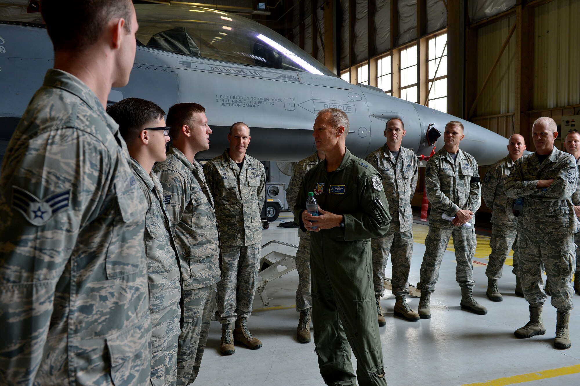 U.S. Air Force Maj. Gen. Mark Kelly, Ninth Air Force commander, speaks to 20th Equipment Maintenance Squadron phase inspection team Airmen during an immersion tour at Shaw Air Force Base, S.C., Aug. 7, 2015. Kelly, the new commander of Ninth Air Force, visited Airmen around base to meet Airmen and learn about their mission. (U.S. Air Force photo by Senior Airman Diana M. Cossaboom/Released)