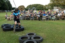 An Airman attempts to complete the obstacle course during the 3rd annual Combat Dining In, Aug. 14, 2015, at Seymour Johnson Air Force Base, North Carolina. Airmen who were found to be in violation of the rules of the mess were sent to the obstacle course, where they had to complete a series of challenges and drink from the dreaded “Grog Bowl.” (U.S. Air Force photo/Senior Airman Brittain Crolley)