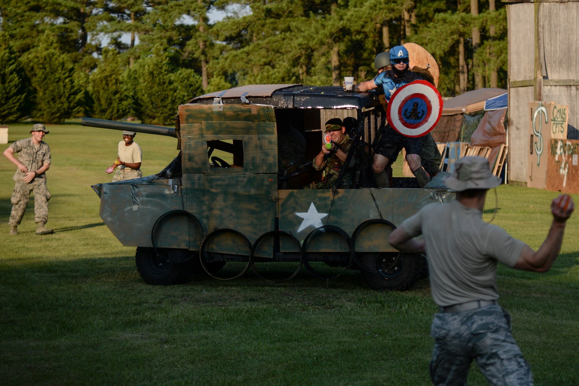 A “tank” comes under siege during the 3rd annual Combat Dining In, Aug. 14, 2015, at Seymour Johnson Air Force Base, North Carolina. All forms of aquatic weaponry were permitted to eliminate enemy threats, including water guns, water balloons, fire hoses, and more. (U.S. Air Force photo/Senior Airman Brittain Crolley)