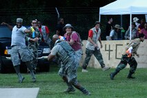 An Airman from the 4th Mission Support Group “engages the enemy” during the 3rd annual Combat Dining In, Aug. 14, 2015, at Seymour Johnson Air Force Base, North Carolina. The 4th Communication Squadron weathered the assault and sent their attackers into full retreat. (U.S. Air Force photo/Senior Airman Brittain Crolley)