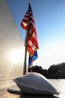 The American and Air Force flags sit center stage during the 3rd annual Combat Dining In, Aug. 14, 2015, at Seymour Johnson Air Force Base, North Carolina. CDIs are designed to give commanders an opportunity to meet socially with their Airmen and enables military members of all ranks to exercise social resilience. (U.S. Air Force photo/Senior Airman Brittain Crolley)