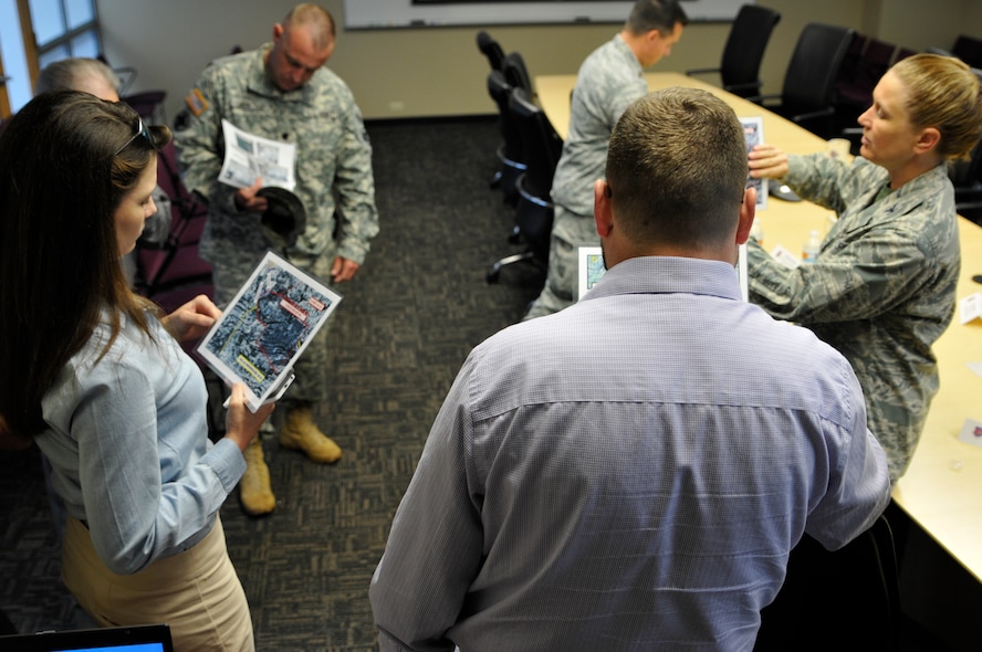 Five members of U.S. Rep. Steve Womack’s (R-Rogers) local and Washington D.C. staff toured the 188th Wing and Fort Chaffee Maneuver Training Center Aug. 14, 2015. The group received briefs on the two installations’ combined capabilities to provide superior training environments and also participated in an aerial tour on a UH-60 Black Hawk with the Arkansas Army National Guard’s 77th Theater Aviation Brigade. The objective of the aerial tour was to view assets at Fort Chaffee Joint Maneuver Training Center and 188th Detachment 1 Razorback Range.  (U.S. Air National Guard photo by Tech. Sgt. Chauncey Reed/Released)