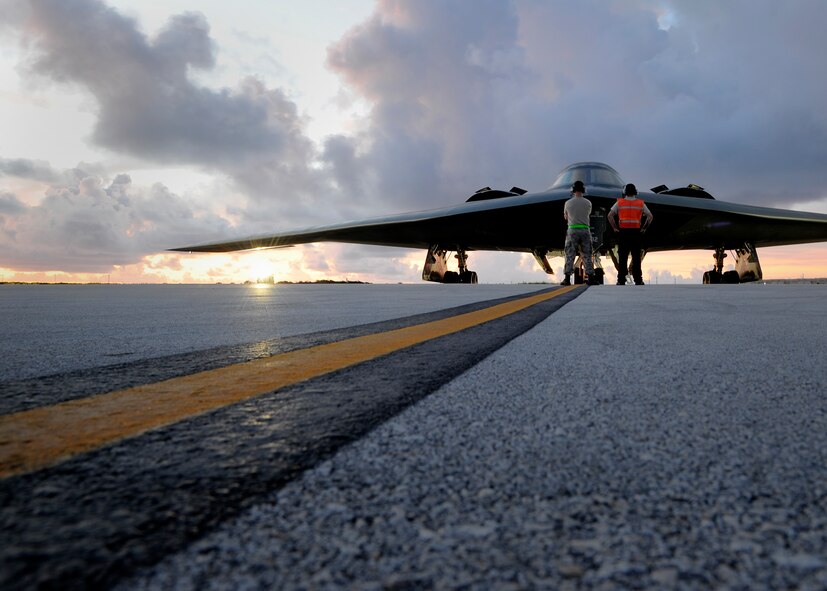 Crew chiefs assigned to the 509th Aircraft Maintenance Squadron prepare to launch a U.S. Air Force B-2 Spirit at Andersen Air Force Base, Guam, Aug. 12, 2015. Three B-2s and about 225 Airmen from Whiteman Air Force Base, Missouri, deployed to Guam to conduct familiarization training activities in the Indo-Asia-Pacific region. (U.S. Air Force photo by Senior Airman Joseph A. Pagán Jr./Released)