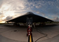 A U.S. Air Force B-2 Spirit is prepared for a mission on the flightline at Andersen Air Force Base, Guam, Aug. 12, 2015. Three B-2s and about 225 Airmen from Whiteman Air Force Base, Missouri, deployed to Guam to conduct familiarization training activities in the Indo-Asia-Pacific region. (U.S. Air Force photo by Senior Airman Joseph A. Pagán Jr./Released)