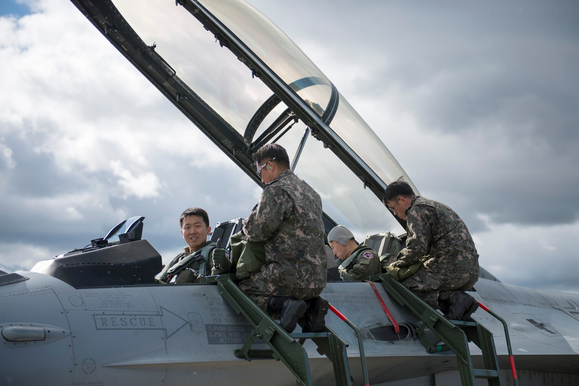 Republic of Korea Air Force (ROKAF) Majs. Lee Jong Won and Lee Dong Seop, both ROKAF F-16D Fighting Falcon pilots, ensure their equipment is secured prior to the launch of a RED FLAG-Alaska (RF-A) 15-3 sortie, Aug. 11, 2015 from Eielson Air Force Base, Alaska. Units from across the Department of Defense and allied forces have utilized the Joint Pacific Alaska Range Complex’s 67,000 square miles of airspace for RED FLAG-Alaska since 2006 because it is the largest instrumented air, ground and electronic combat training range in the world. (U.S. Air Force photo by 1st Lt. Elias Zani/Released)
