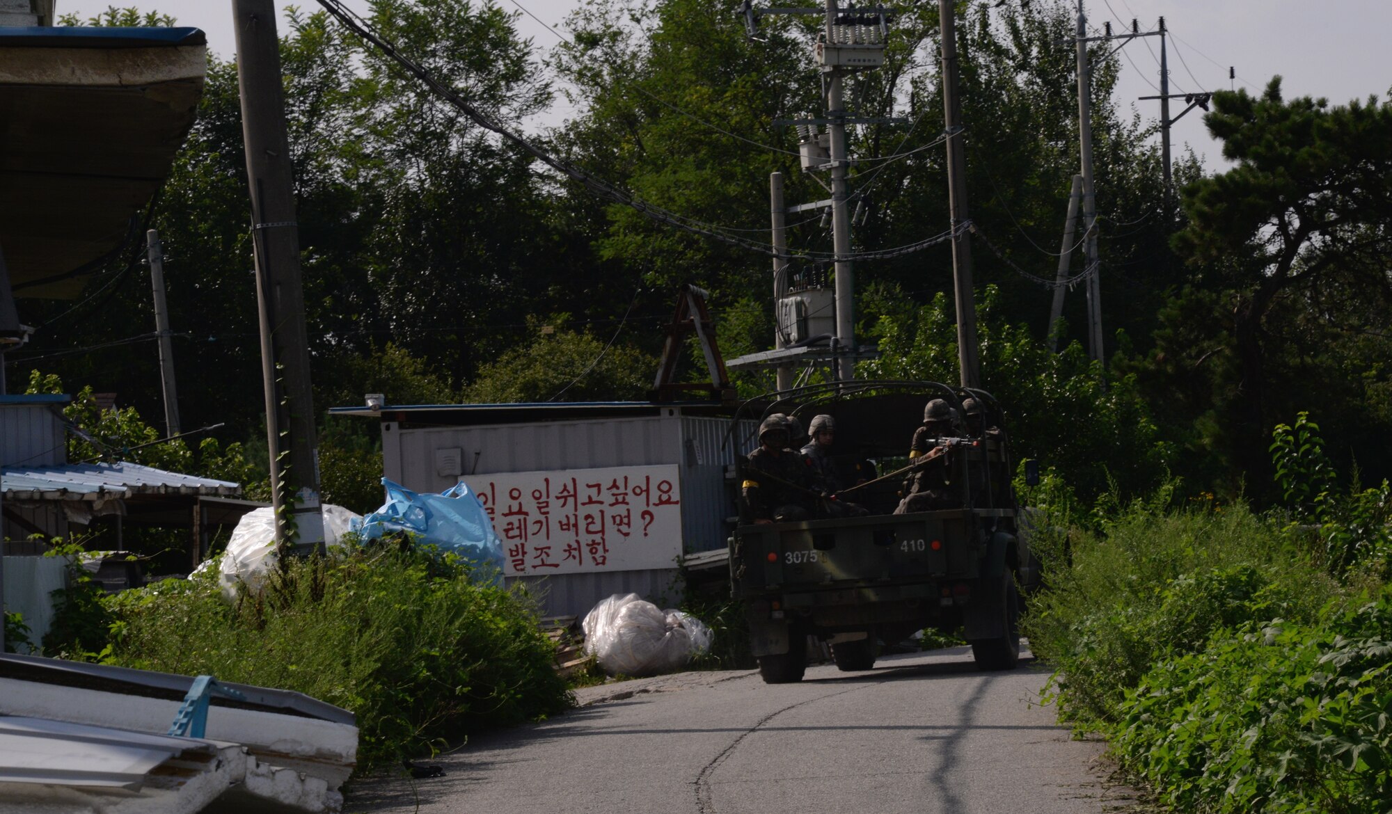 51st Security Forces Squadron and Republic of Korea Army members ride inside the back of a truck during an exercise simulation patrol Aug. 18, 2015, near Pyeongtaek, South Korea. The readiness exercise Beverly Midnight 15-03 fosters a collaborative working environment that helps develop members for simulated combined operations. (U.S. Air Force photo by Staff Sgt. Benjamin Sutton) 