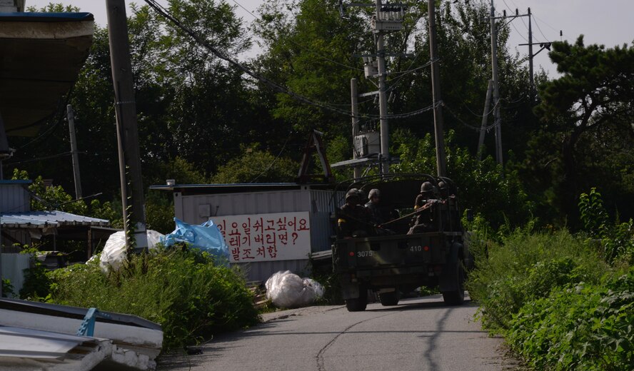 51st Security Forces Squadron and Republic of Korea Army members ride inside the back of a truck during an exercise simulation patrol Aug. 18, 2015, near Pyeongtaek, South Korea. The readiness exercise Beverly Midnight 15-03 fosters a collaborative working environment that helps develop members for simulated combined operations. (U.S. Air Force photo by Staff Sgt. Benjamin Sutton) 