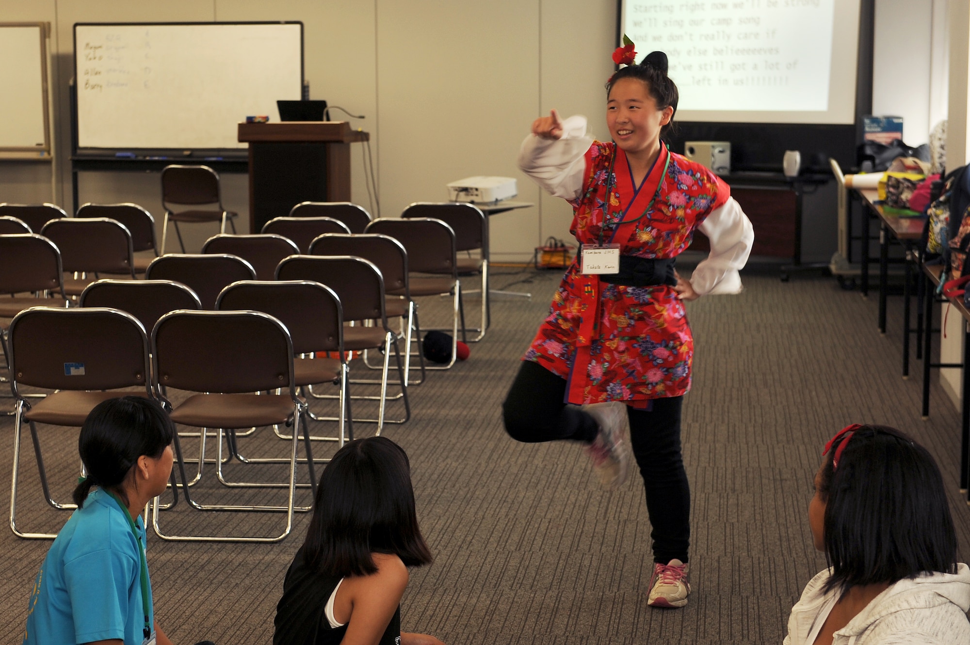 Karin Takata, a Kamihara Junior High School student, performs a traditional Japanese dance for American students at an English Summer Camp in Naha, Japan, Aug. 14, 2015. The two-day camp was designed to make Japanese elementary and middle school students more comfortable with their English speaking skills while allowing American and Japanese students to learn more about each other’s cultures. (U.S. Air Force photo by Airman 1st Class Zade C. Vadnais)