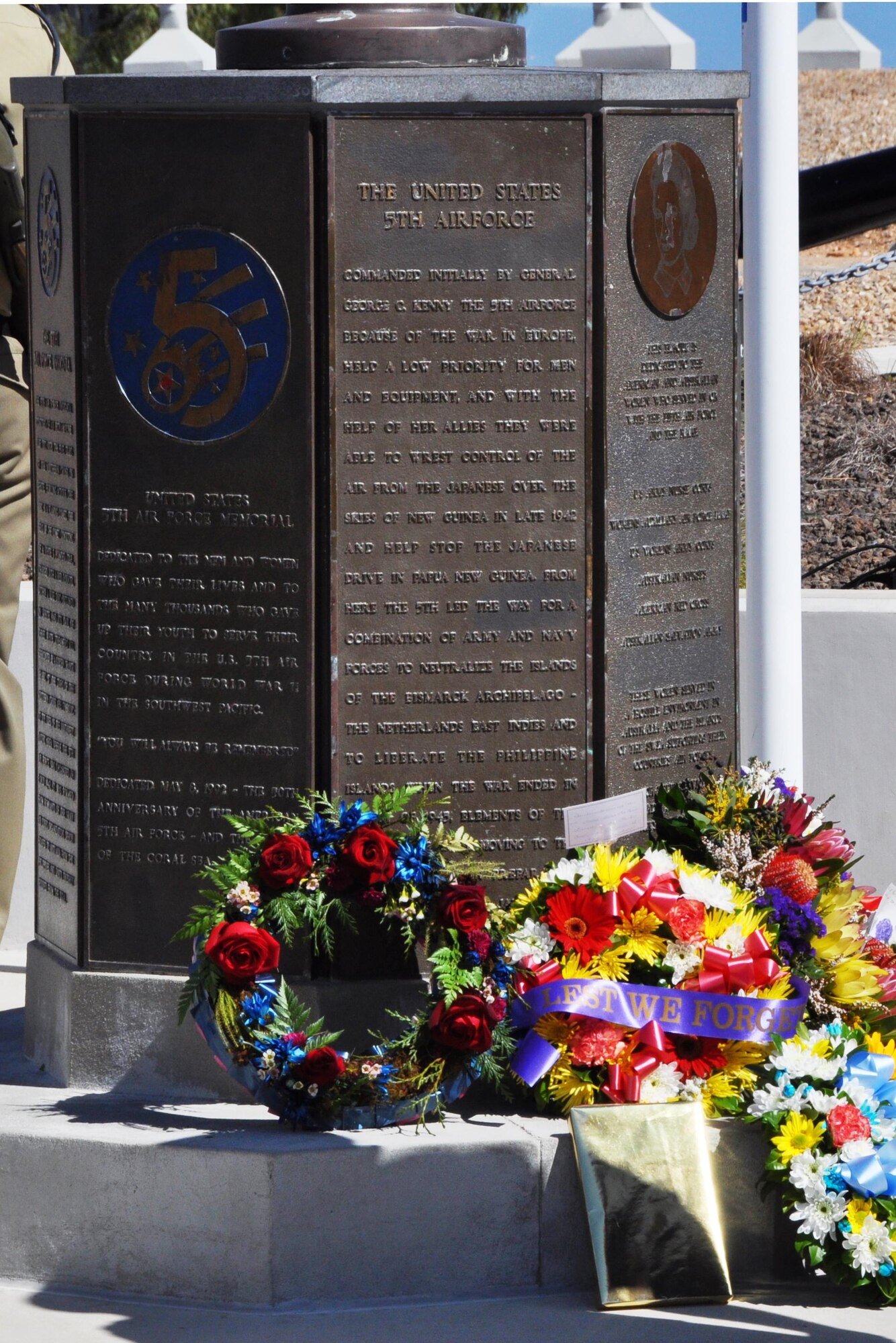 Wreaths and mementos placed at the base of the 5th Air Force Memorial during a memorial service, Aug. 16, 2015, reflect the honor and respect shown towards the men and women who served in the command during World War II. The 5th Air Force Memorial at Kissing Point, Townsville, Australia, was erected to honor and remember the men and women who gave their lives and to the many thousands who gave up their youth to serve their country in 5th Air Force during WW II. (U.S. Air Force photo by Capt. George M. Tobias/Released)