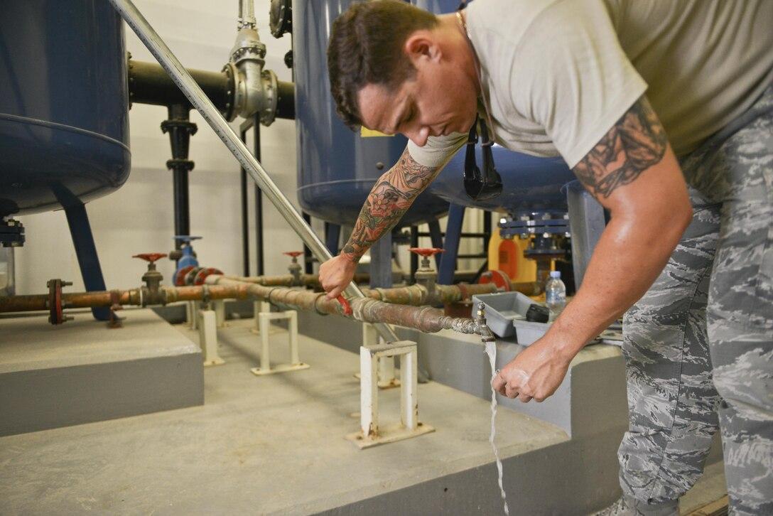 Staff Sgt. Jon Dones, , 379th Expeditionary Civil Engineer Squadron water and fuels, tests the P.H. balance of filtered water that is used for indoor plumbing throughout the Blatchford Preston Complex August 16, 2015 at Al Udeid Air Base, Qatar. With the high number of deployed members here at Al Udeid, the 379th ECES water and fuels airmen stay busy day and night keeping the systems running to support the base. (U.S. Air Force photo/ Staff Sgt. Alexandre Montes) 