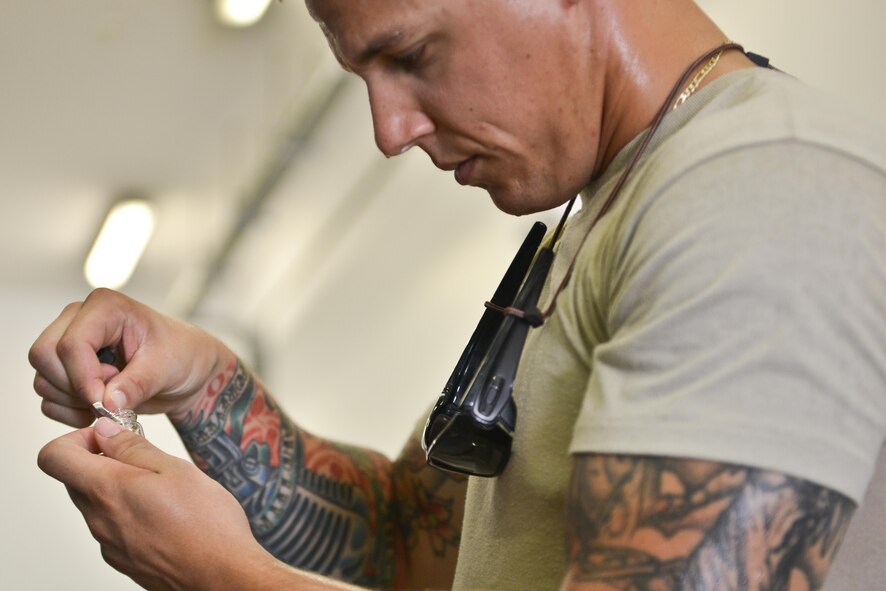 Staff Sgt. Jon Dones, 379th Expeditionary Civil Engineer Squadron water and fuels, tests the P.H. balance of filtered water that is used for indoor plumbing throughout the Blatchford Preston Complex August 16, 2015 at Al Udeid Air Base, Qatar. With the high number of deployed members here at Al Udeid, the 379th ECES water and fuels airmen stay busy day and night keeping the systems running to support the base. (U.S. Air Force photo/ Staff Sgt. Alexandre Montes) 