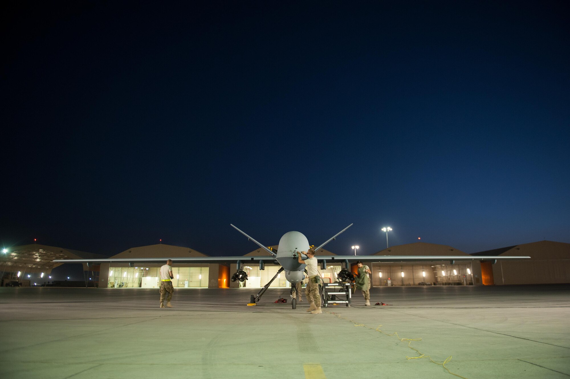 U.S. Airmen assigned to the 62nd Expeditionary Reconnaissance Squadron perform a post flight inspection on a MQ-9 Reaper aircraft at Kandahar Airfield, Afghanistan, Aug. 13, 2015.  The 62nd ERS operates the MQ-1B Predator and Reaper aircraft and provides world-class close air support, intelligence, surveillance and reconnaissance capabilities in Afghanistan. (U.S. Air Force photo by Tech. Sgt. Joseph Swafford/Released) 