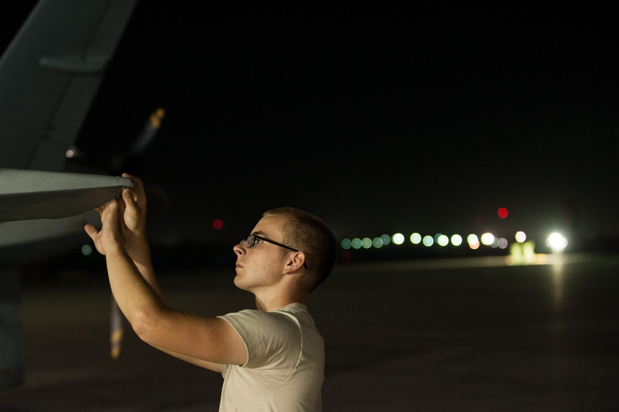 A U.S. Airman assigned to the 62nd Expeditionary Reconnaissance Squadron performs a post flight inspection on a MQ-9 Reaper aircraft at Kandahar Airfield, Afghanistan, Aug. 13, 2015.  The 62nd ERS operates the MQ-1 Predator and Reaper aircraft and provides world-class close air support, intelligence, surveillance and reconnaissance capabilities in Afghanistan. (U.S. Air Force photo by Tech. Sgt. Joseph Swafford/Released) 