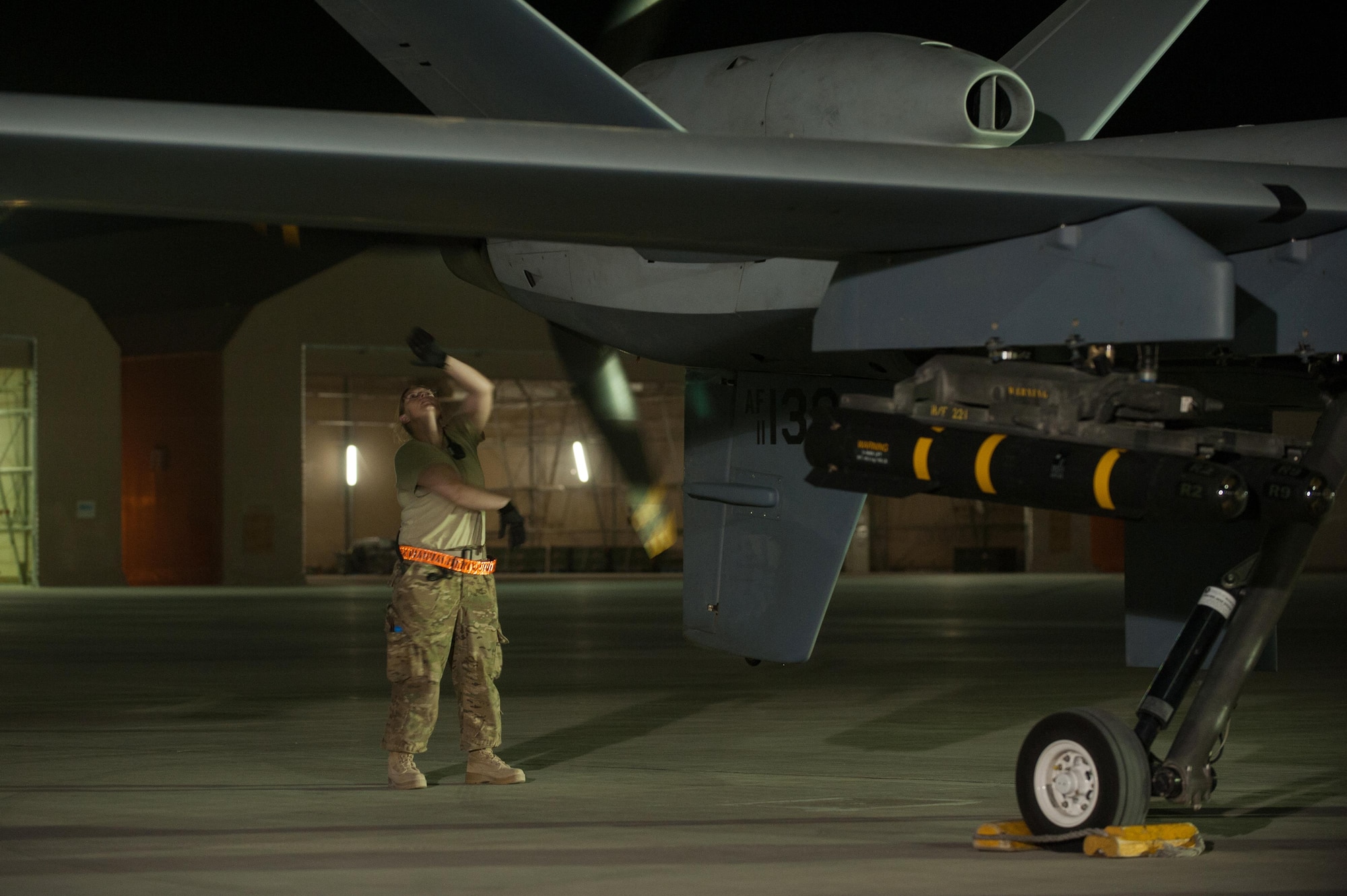 A U.S. Airman assigned to the 62nd Expeditionary Reconnaissance Squadron performs a post flight inspection on a MQ-9 Reaper aircraft at Kandahar Airfield, Afghanistan, Aug. 13, 2015.  The 62nd ERS operates the MQ-1B Predator and Reaper aircraft and provides world-class close air support, intelligence, surveillance and reconnaissance capabilities in Afghanistan. (U.S. Air Force photo by Tech. Sgt. Joseph Swafford/Released)   
