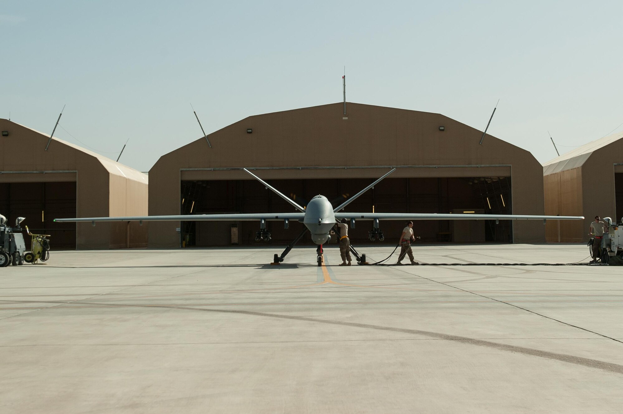 U.S. Airmen assigned to the 62nd Expeditionary Reconnaissance Squadron perform a preflight inspection on a MQ-9 Reaper aircraft at Kandahar Airfield, Afghanistan, Aug. 14, 2015.  The 62nd ERS operates the MQ-1B Predator and Reaper aircraft and provides world-class close air support, intelligence, surveillance and reconnaissance capabilities in Afghanistan. (U.S. Air Force photo by Tech. Sgt. Joseph Swafford/Released)   