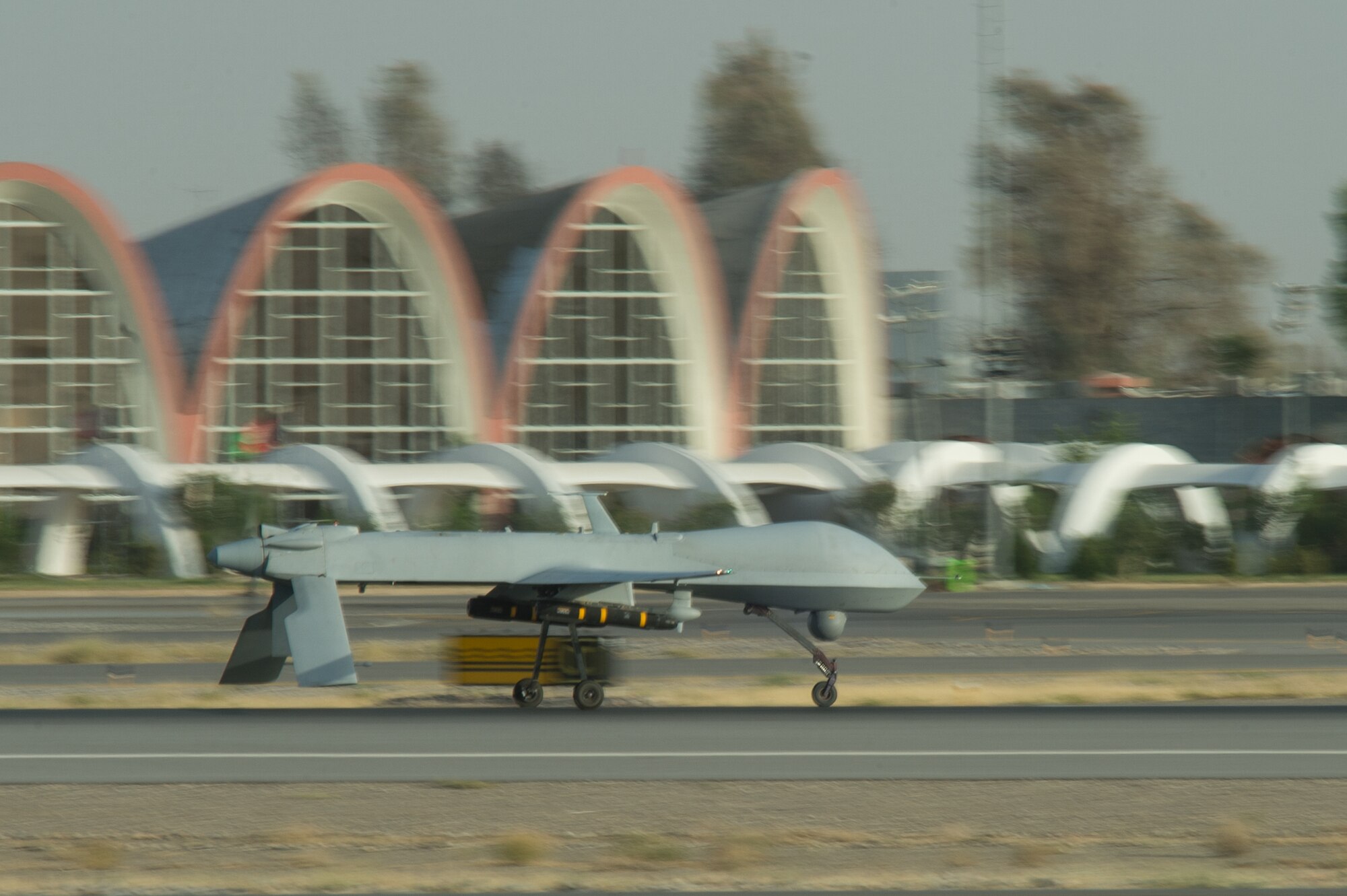 A U.S. Air Force MQ-1B Predator aircraft assigned to the 62nd Expeditionary Reconnaissance Squadron lands at Kandahar Airfield, Afghanistan, Aug. 13, 2015.  The 62nd ERS operates the Predator and MQ-9 Reaper aircraft and provides world-class close air support, intelligence, surveillance and reconnaissance capabilities in Afghanistan. (U.S. Air Force photo by Tech. Sgt. Joseph Swafford/Released)